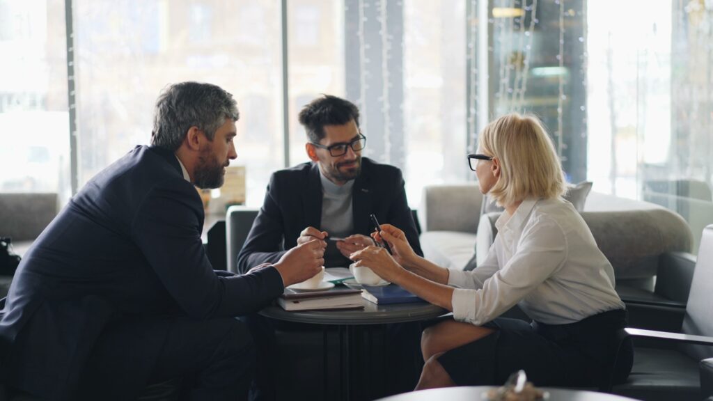 TM-Tec consultants in a meeting